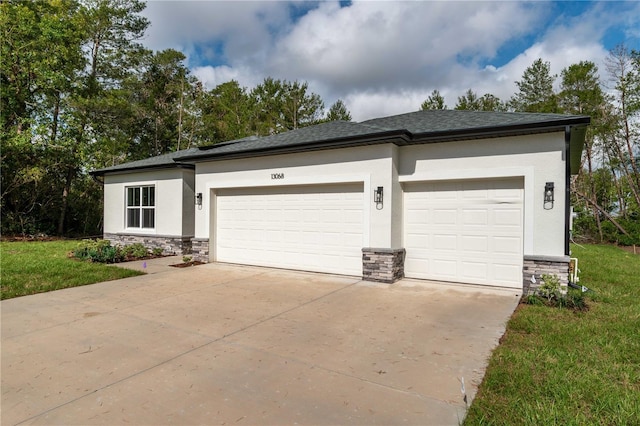 garage featuring concrete driveway