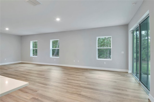 spare room featuring recessed lighting, baseboards, visible vents, and light wood finished floors