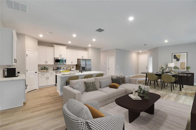 13068 SW 36th Ct, Ocala, FL 34473 - living area featuring light wood-type flooring and recessed lighting