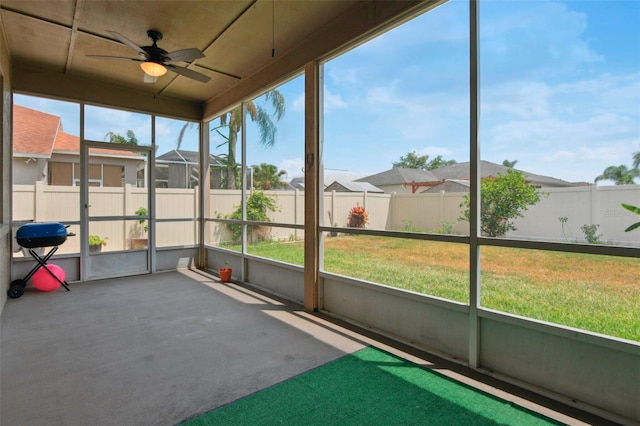 29704 Eagle Station Dr, Wesley Chapel, FL 33543 - unfurnished sunroom with a residential view and a ceiling fan