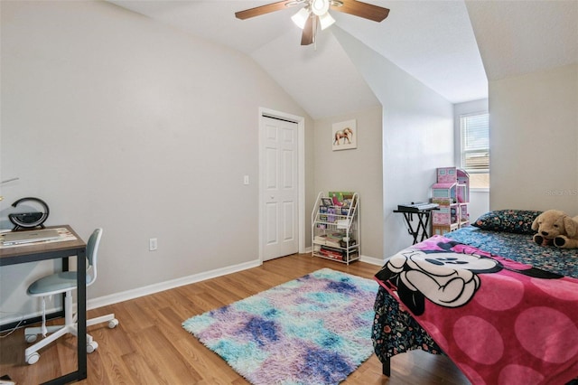 29704 Eagle Station Dr, Wesley Chapel, FL 33543 - bedroom with a ceiling fan, vaulted ceiling, baseboards, and wood finished floors