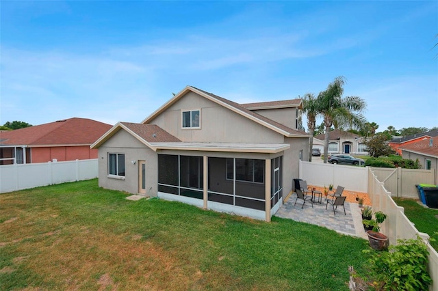 29704 Eagle Station Dr, Wesley Chapel, FL 33543 - back of house with a lawn, a patio area, a sunroom, and a fenced backyard
