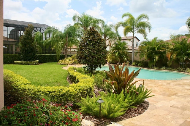 outdoor pool with fence and a yard