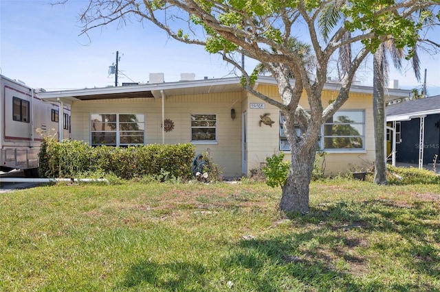 15406 2nd St E, Madeira Beach, FL 33708 - exterior space featuring a front lawn