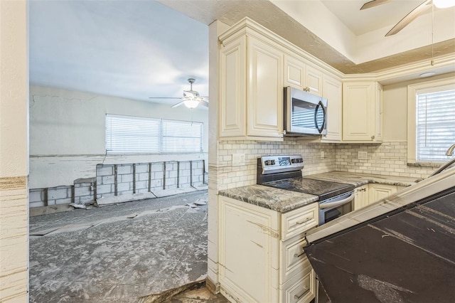 15406 2nd St E, Madeira Beach, FL 33708 - kitchen featuring appliances with stainless steel finishes, plenty of natural light, ceiling fan, and tasteful backsplash