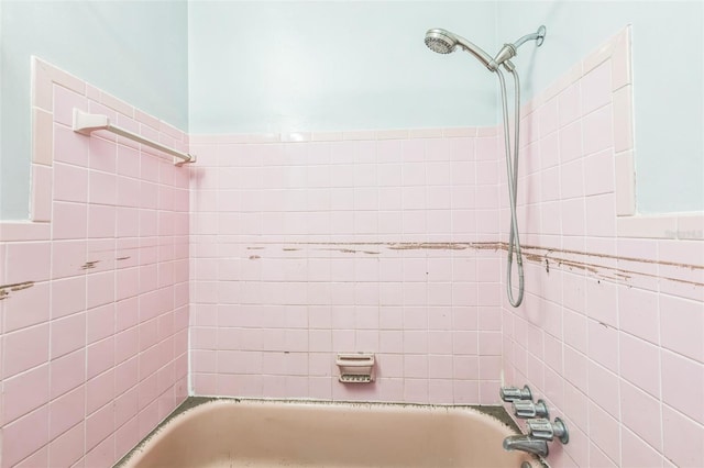 15406 2nd St E, Madeira Beach, FL 33708 - bathroom featuring tile walls and  shower combination