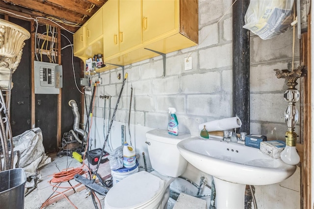 15406 2nd St E, Madeira Beach, FL 33708 - bathroom with toilet, concrete flooring, a sink, and electric panel