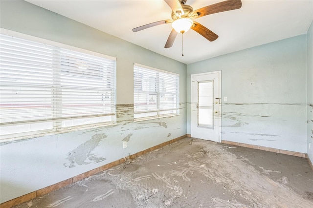 15406 2nd St E, Madeira Beach, FL 33708 - unfurnished room featuring baseboards and ceiling fan