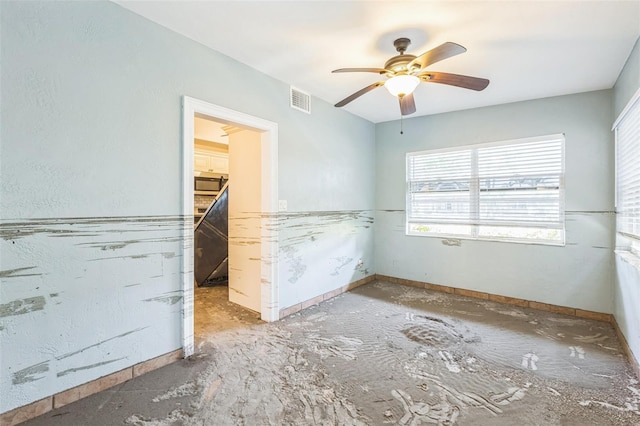 15406 2nd St E, Madeira Beach, FL 33708 - unfurnished bedroom featuring ceiling fan, visible vents, multiple windows, and baseboards