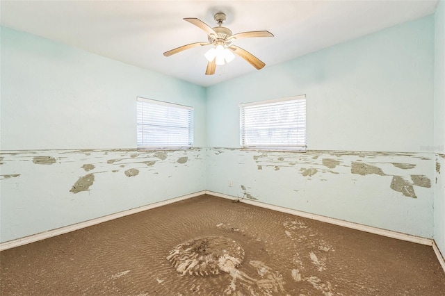 15406 2nd St E, Madeira Beach, FL 33708 - carpeted empty room with baseboards and a ceiling fan