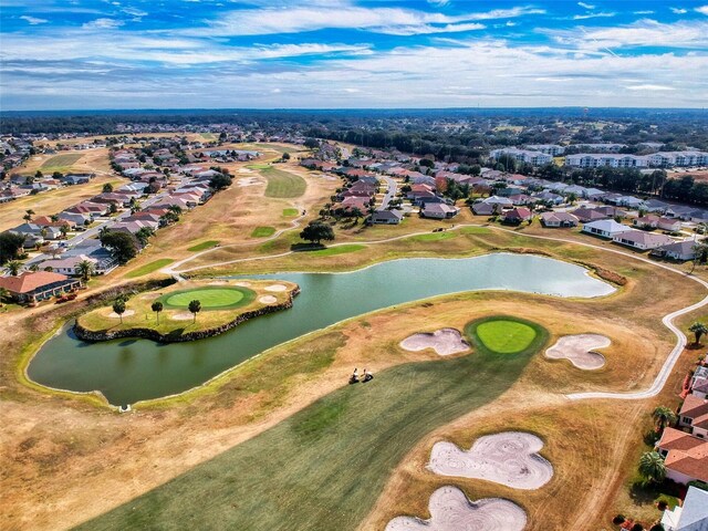 birds eye view of property featuring a water view and a residential view