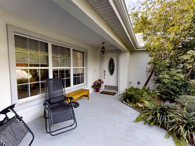 property entrance with stucco siding