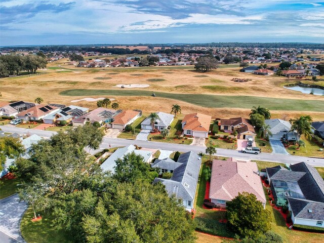 birds eye view of property featuring golf course view and a residential view