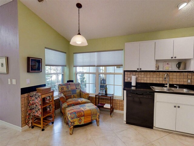 kitchen with open shelves, dark countertops, white cabinets, a sink, and dishwasher