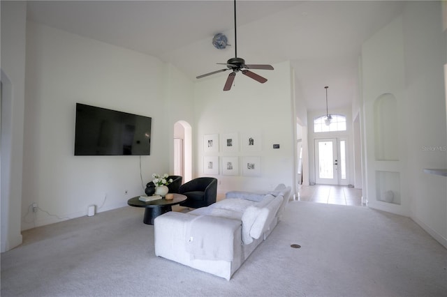 23533 Valderama Ln, Sorrento, FL 32776 - carpeted living room with arched walkways, a ceiling fan, and high vaulted ceiling