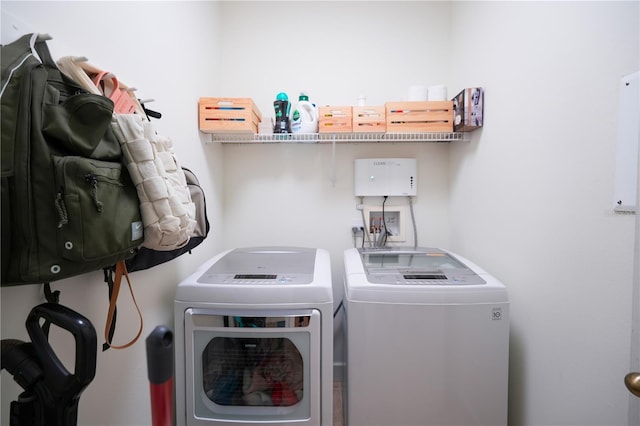 23533 Valderama Ln, Sorrento, FL 32776 - washroom with laundry area and washer and clothes dryer