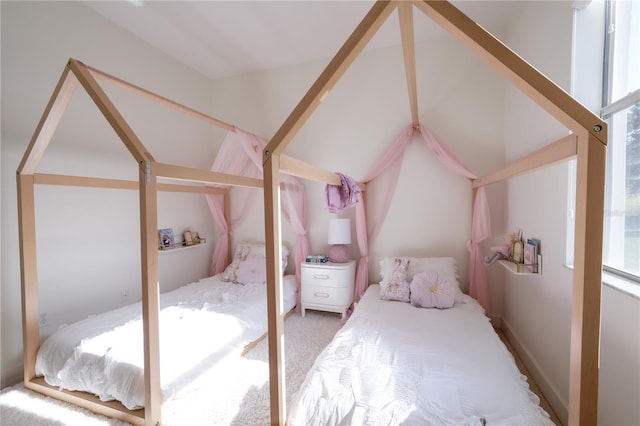 23533 Valderama Ln, Sorrento, FL 32776 - carpeted bedroom featuring multiple windows and lofted ceiling