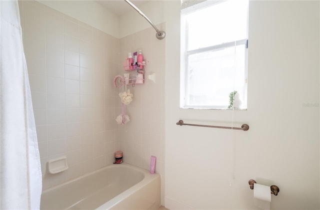 23533 Valderama Ln, Sorrento, FL 32776 - bathroom featuring a healthy amount of sunlight and shower / tub combo
