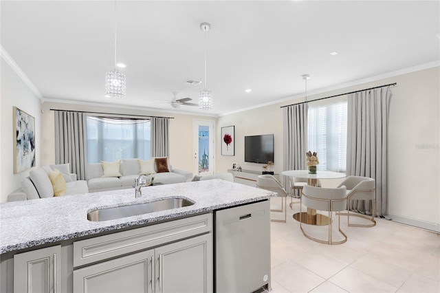 kitchen featuring stainless steel dishwasher, a sink, open floor plan, and ornamental molding