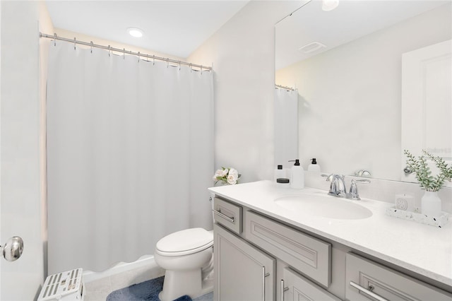 full bathroom with vanity, tile patterned flooring, toilet, and curtained shower