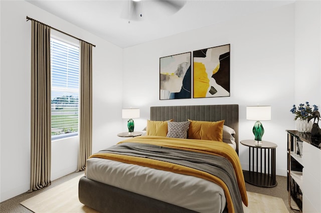 carpeted bedroom featuring a ceiling fan and baseboards