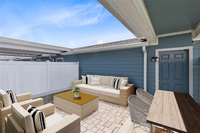 view of patio featuring fence, outdoor lounge area, and outdoor dining space