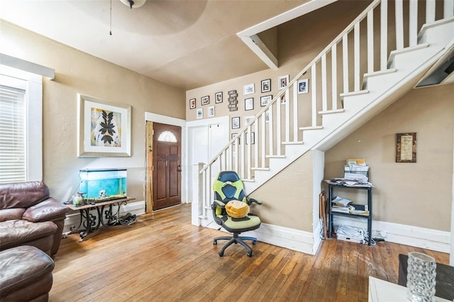 419 Palm Ave, Eustis, FL 32726 - entrance foyer featuring baseboards, wood-type flooring, and stairs