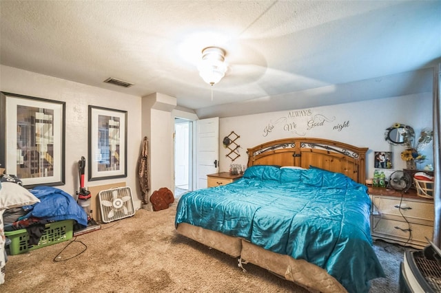 419 Palm Ave, Eustis, FL 32726 - bedroom featuring carpet, a textured ceiling, and visible vents