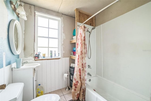 419 Palm Ave, Eustis, FL 32726 - bathroom with tile patterned flooring, a wainscoted wall, vanity, toilet, and shower / bathtub combination with curtain