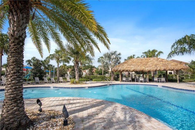 pool with a patio, a gazebo, and fence