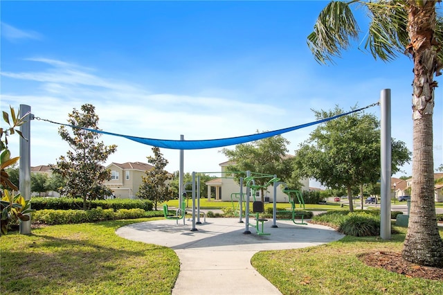 view of community featuring playground community and a yard