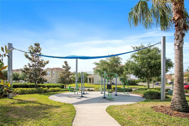 view of home's community with a lawn and playground community
