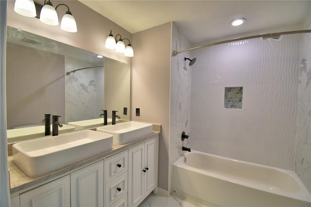 full bath with shower / bathtub combination, marble look tiles, double vanity, and recessed lighting