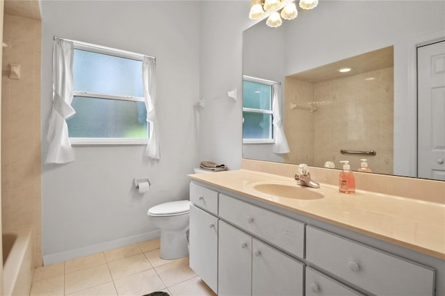 bathroom featuring toilet, tile patterned floors, baseboards, and vanity
