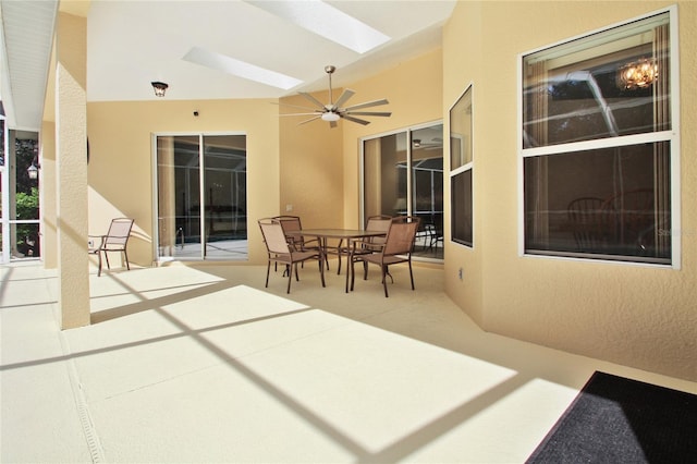 view of patio / terrace with a ceiling fan and outdoor dining area