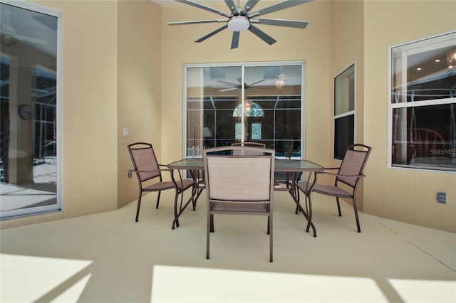 view of patio featuring ceiling fan and outdoor dining space