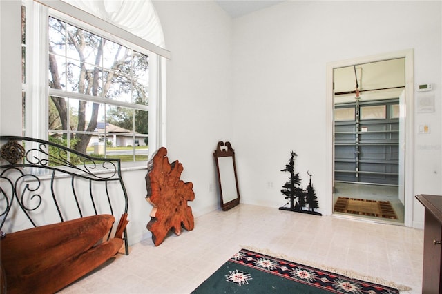 living area featuring tile patterned floors