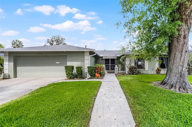 ranch-style house featuring a garage, stucco siding, concrete driveway, and a front lawn