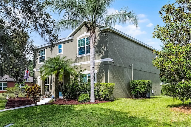 913 Bending Oak Trl, Winter Garden, FL 34787 - view of front facade featuring stucco siding and a front lawn