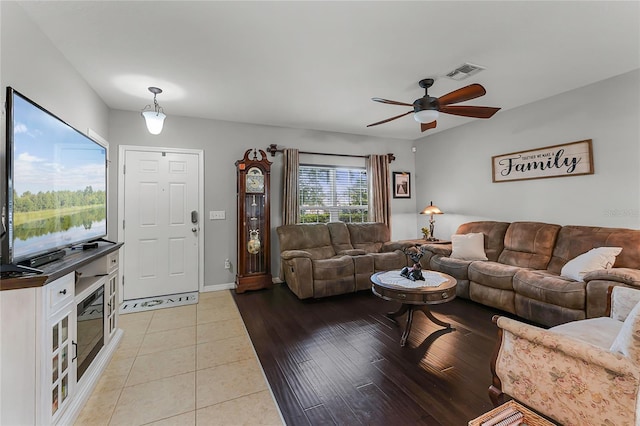 913 Bending Oak Trl, Winter Garden, FL 34787 - living area with a ceiling fan, light tile patterned floors, and baseboards