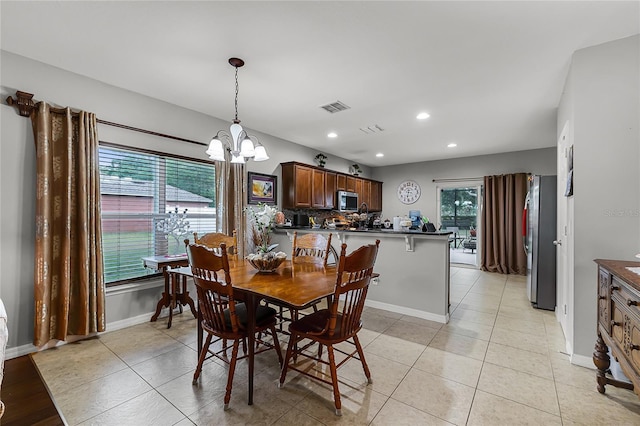 913 Bending Oak Trl, Winter Garden, FL 34787 - dining room with a chandelier, recessed lighting, baseboards, and light tile patterned floors