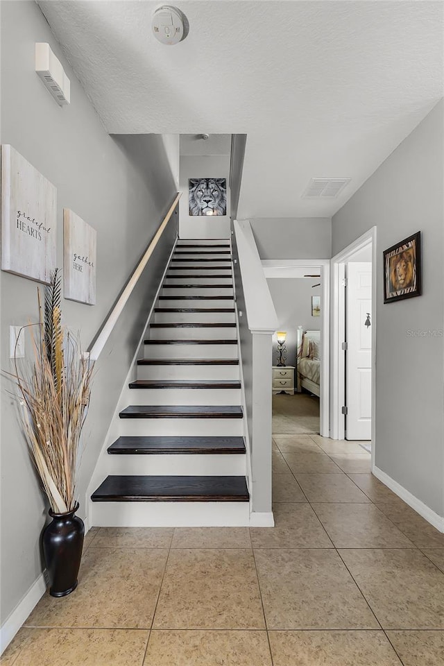 913 Bending Oak Trl, Winter Garden, FL 34787 - stairs featuring baseboards and tile patterned flooring