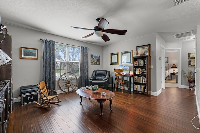 913 Bending Oak Trl, Winter Garden, FL 34787 - living area featuring ceiling fan, baseboards, hardwood / wood-style flooring, and a textured ceiling