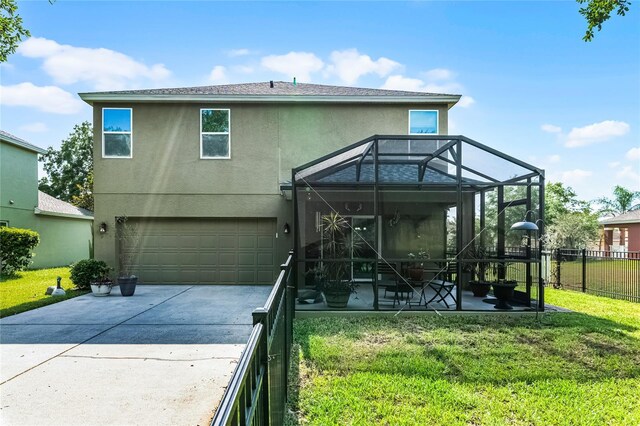 913 Bending Oak Trl, Winter Garden, FL 34787 - rear view of property with a garage, stucco siding, concrete driveway, a lanai, and a patio area