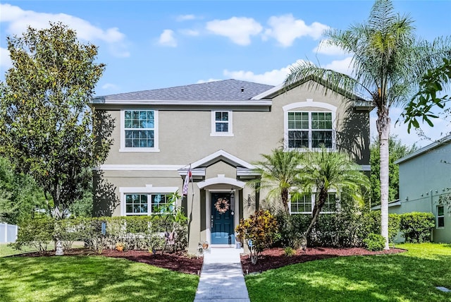 913 Bending Oak Trl, Winter Garden, FL 34787 - view of front of property with stucco siding and a front yard