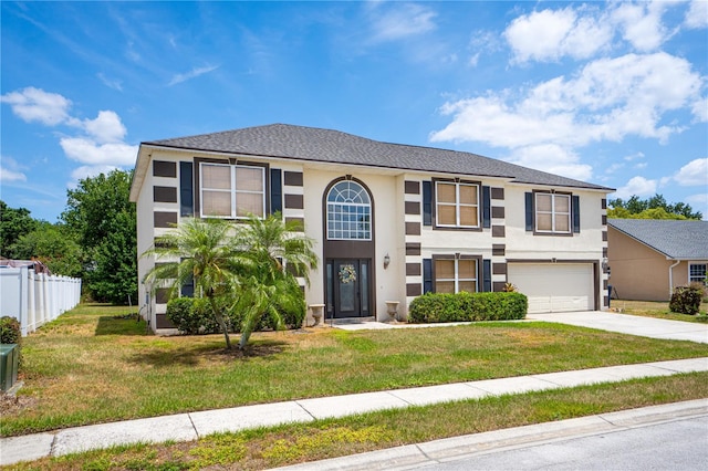 114 Shaddock Dr, Auburndale, FL 33823 - view of front of home featuring fence, an attached garage, driveway, and stucco siding