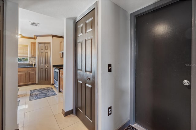 114 Shaddock Dr, Auburndale, FL 33823 - hall with visible vents, baseboards, and light tile patterned floors