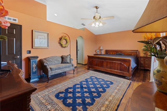 114 Shaddock Dr, Auburndale, FL 33823 - bedroom featuring visible vents, arched walkways, wood finished floors, and vaulted ceiling