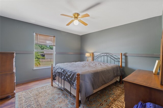 114 Shaddock Dr, Auburndale, FL 33823 - bedroom with baseboards, a ceiling fan, and wood finished floors