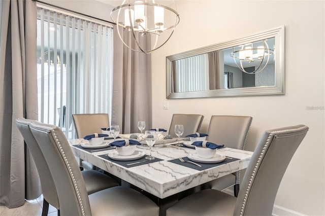 dining area featuring a notable chandelier